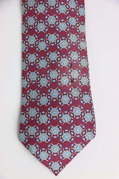 HERMES. Tie in its box, red or burgundy color....