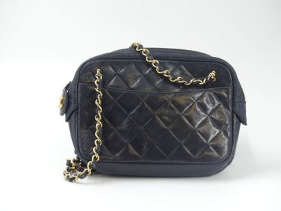 CHANEL. Small quilted camera bag in navy...