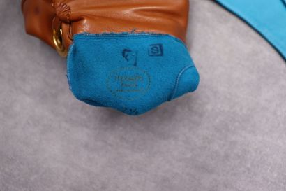 HERMES. Pair of turquoise leather gloves...