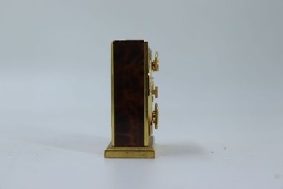 HERMES. Travel alarm clock in gilt metal...