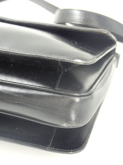 GUCCI. Black leather clutch bag, gold metal...