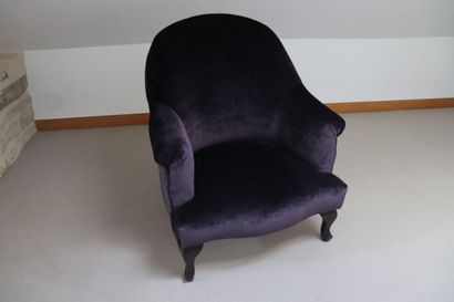 Fauteuil crapaud recouvert d'un velours lisse...