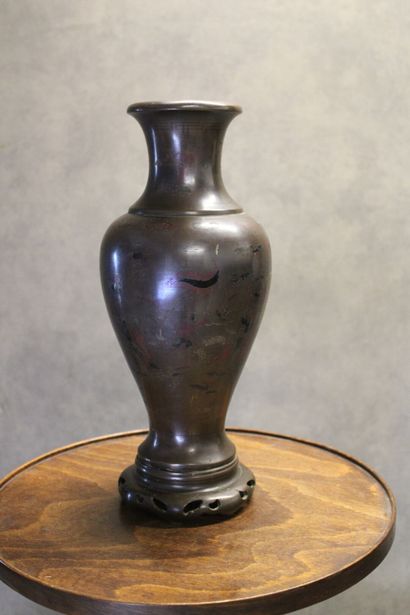 ASIE
Vase of baluster form in patinated bronze...