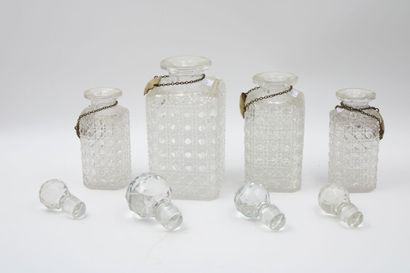 Suite of four crystal flasks cut to the wheel...