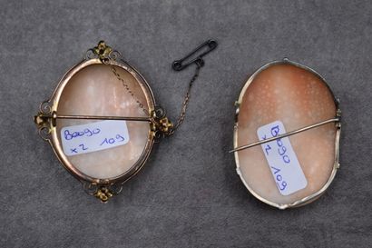 Meeting of two cameos mounted in brooches....