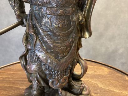 Bronze representing a man with a spear in...