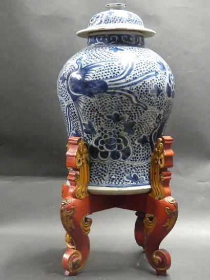 Asia, vase in blue white resting on a wooden...