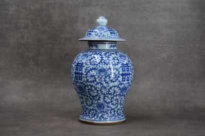 CHINA. Porcelain covered vase with blue flowers....