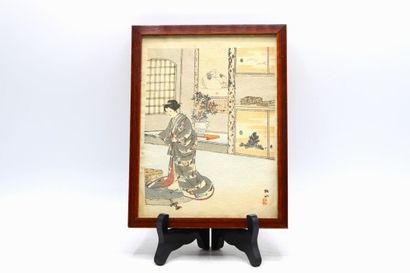 JAPAN. Polychrome print showing a woman in...
