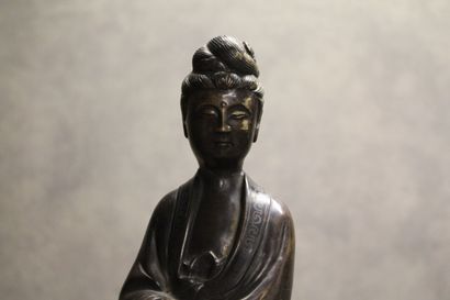CHINA. Divinity in bronze with brown patina...