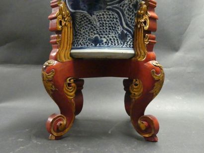 Asia, vase in blue white resting on a wooden...