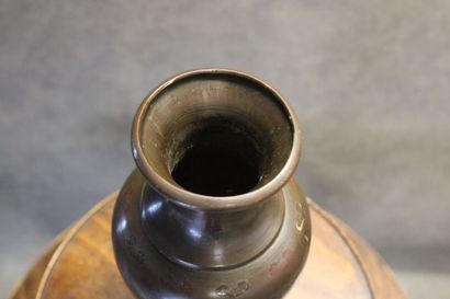 ASIE
Vase of baluster form in patinated bronze...