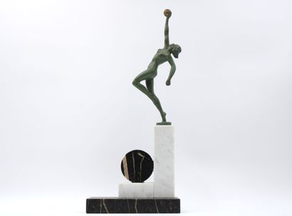 ART DECO 
Woman with a ball, green patinated...