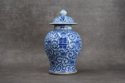 CHINA. Porcelain covered vase with blue flowers....
