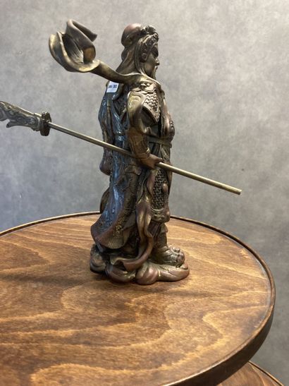 Bronze representing a man with a spear in...