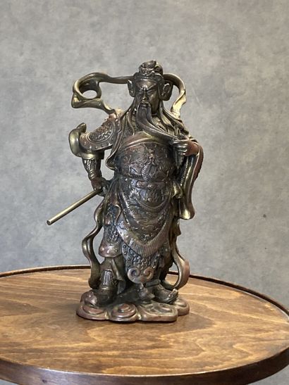 Bronze representing a man with a spear in...