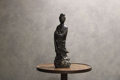 CHINA. Divinity in bronze with brown patina...