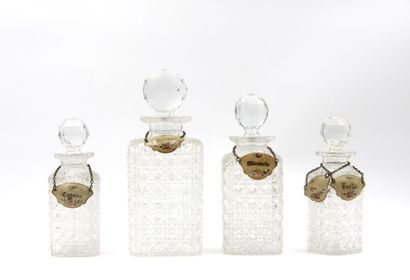 Suite of four crystal flasks cut to the wheel...