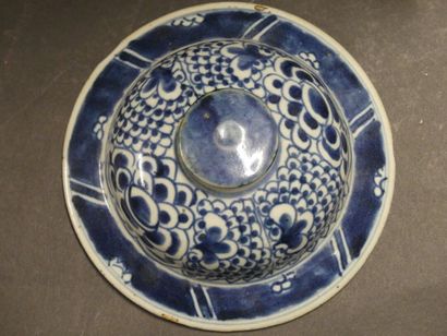 Asia, vase in blue white resting on a wooden...