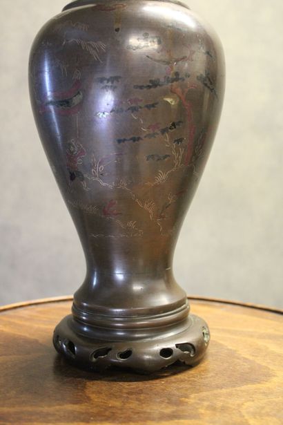 ASIE
Vase of baluster form in patinated bronze...
