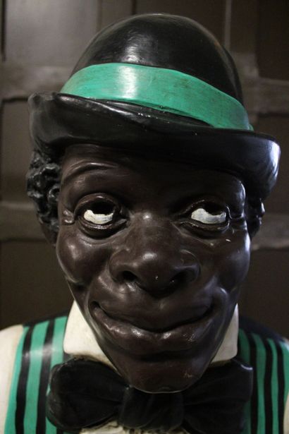 Majordome
Plaster statue of a black man in...