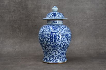 CHINA. Porcelain covered vase with blue flowers....