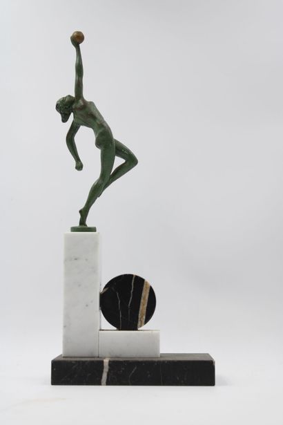 ART DECO 
Woman with a ball, green patinated...