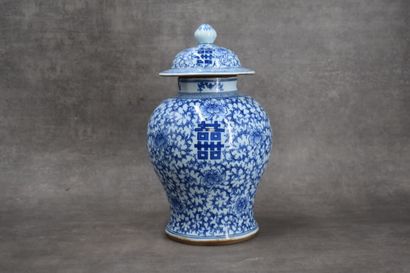 CHINA. Porcelain covered vase with blue flowers....