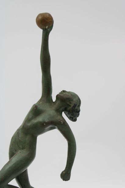 ART DECO 
Woman with a ball, green patinated...