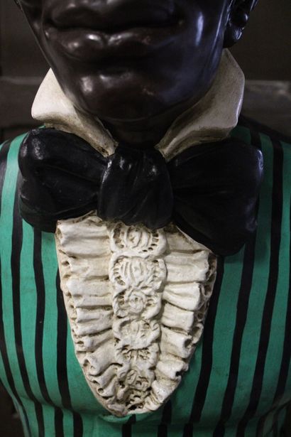 Majordome
Plaster statue of a black man in...