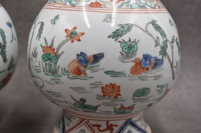 CHINA. Pair of white porcelain vases decorated...