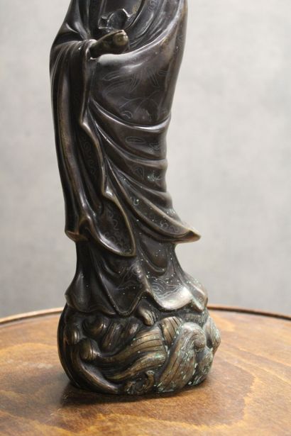 CHINA. Divinity in bronze with brown patina...