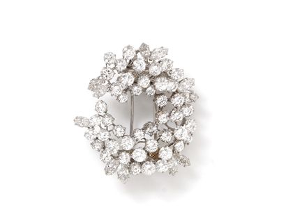 Broche clip en platine 850 et or gris 750...