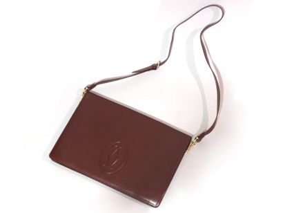 SABATIER 
Brown leather clutch bag. Removable...