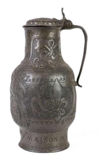 Pewter pitcher with lid, inscribed on the...