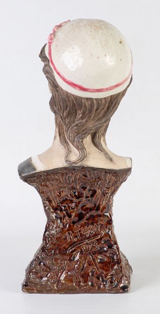 Bust of a woman in barbotine, signed 