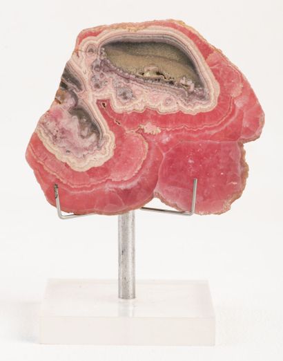 Polished slice on one side of a rare rhodochrosite...