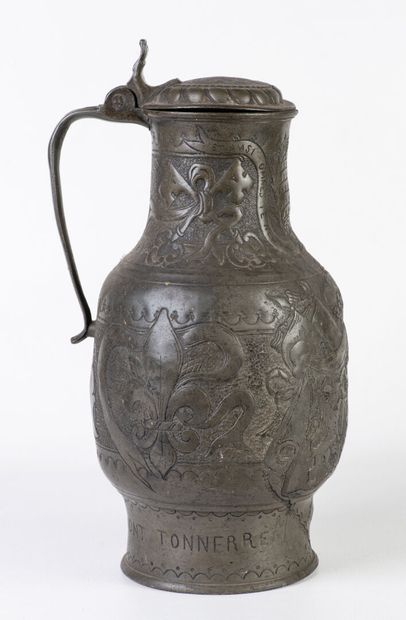 Pewter pitcher with lid, inscribed on the...