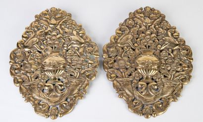 Pair of decorative bronze wall plaques, richly...