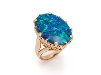 750 thousandths gold ring adorned with a...