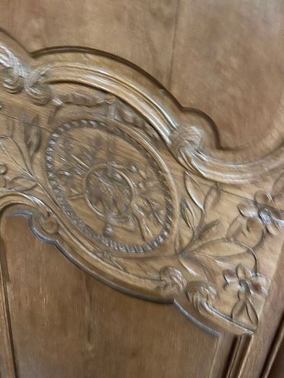 A Norman cabinet in blond oak with a bouquet...