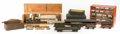 Set of parts in boxes, wheels, screws, and...