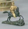 Petit bronze en fonte doré et patiné figurant...