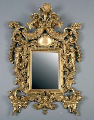 Miroir baroque en bois et stuc doré l'entourage...