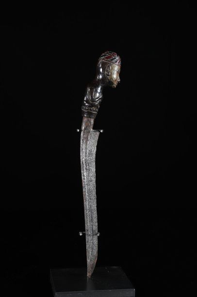 Asia knife and wooden scabbard carved with...