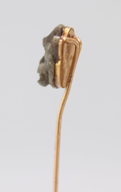 Epingle Fabergé en or surmontée par une tête...