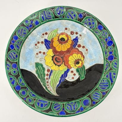 Charles CATTEAU (1880-1966). Grand plat creux...