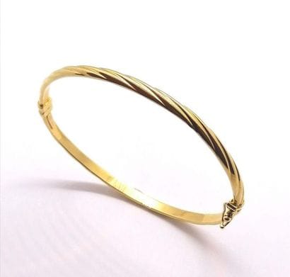 BRACELET JONC OUVRANT en or jaune 18K (750/°°),...