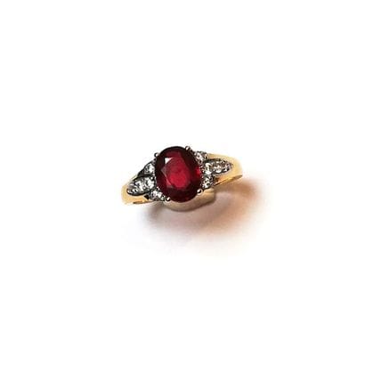 BAGUE en or jaune 14k (585/°°) centrée d'un...