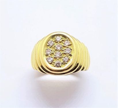 BAGUE en or jaune 18K (750/°°), chevalière...